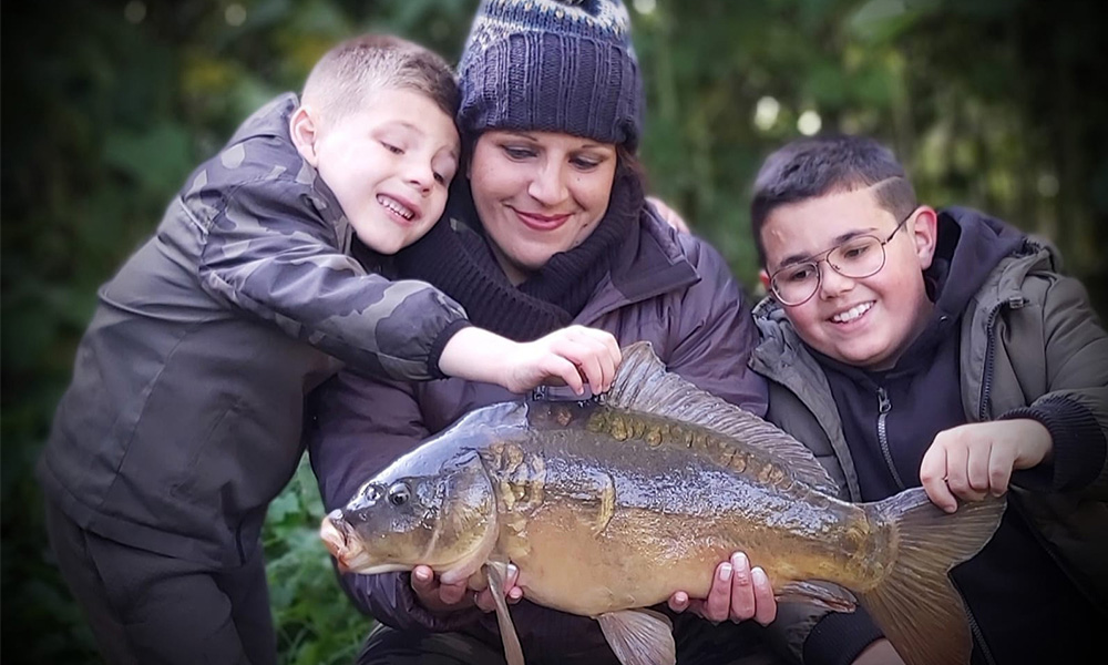 family catching a big fish