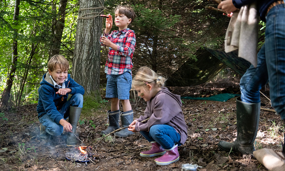 Kids lighting a fire