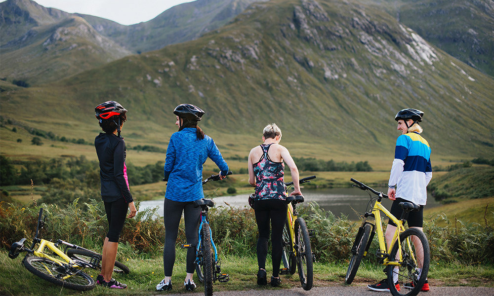 group of friends mountain biking