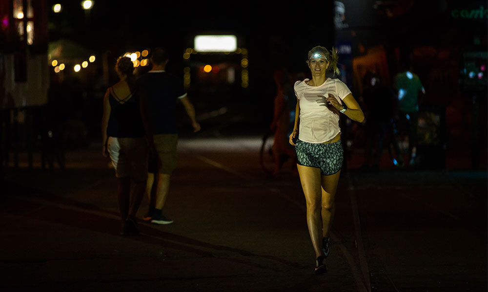 lady running with headtorch