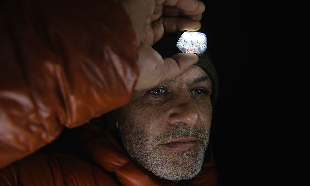 man tilting headtorch