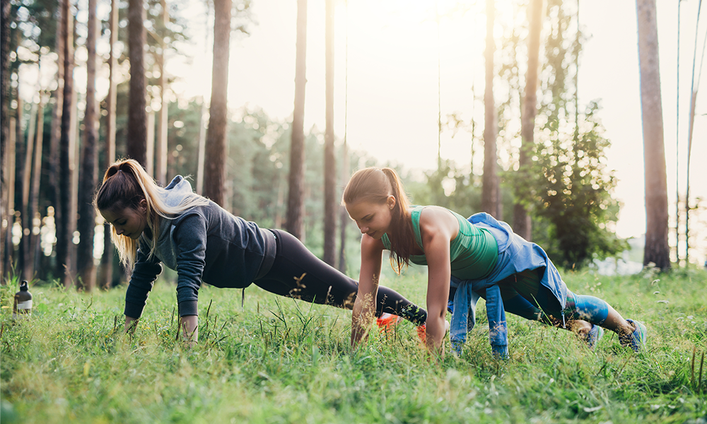 Women exercising in a field during Red January