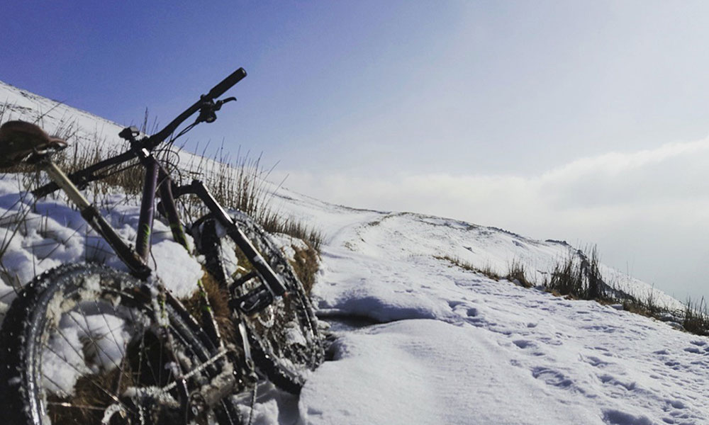 Bike on snowy hillside