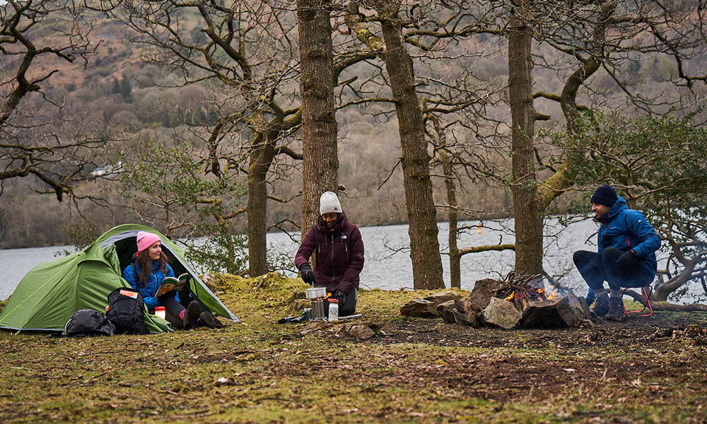 friends camping in forest&nbsp;