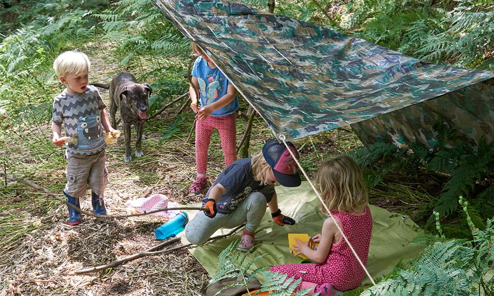 Children enjoying their new den kit