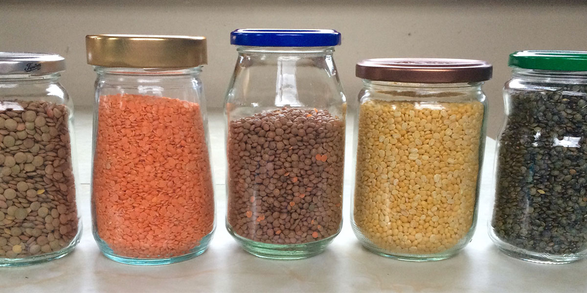 Glass jars on shelves filled with ingredients