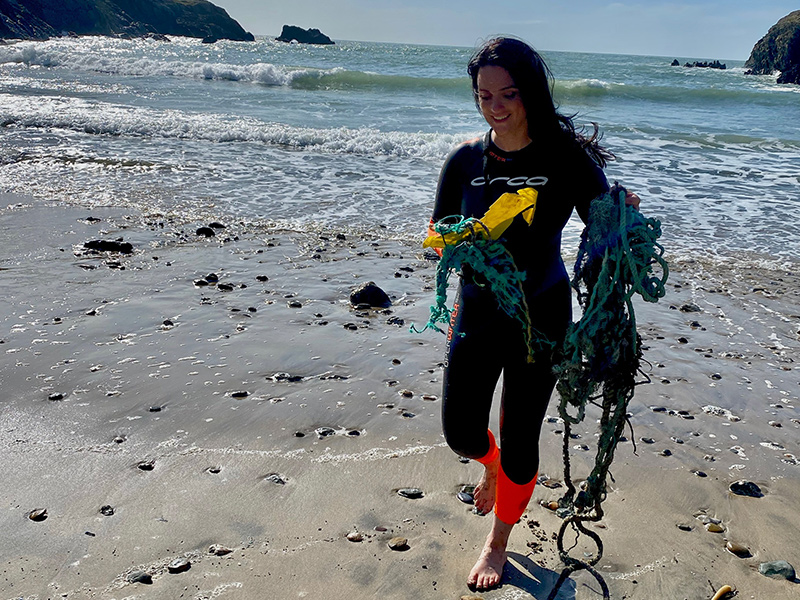 Laura taking rubbish out of the sea