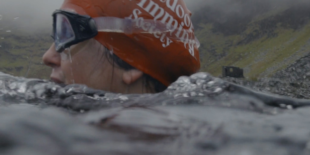 Laura swimming in a lake