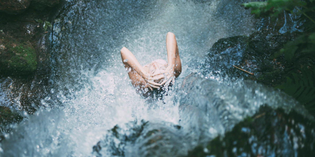Showering in a waterfall