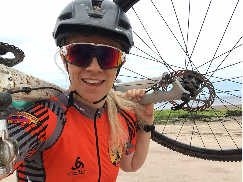 Nicole carrying her bike