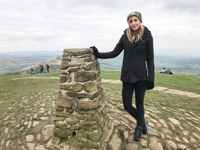 Katherine Kelly at the Trig Pillar on the summit of Mam Tor - © ITV Picture Desk