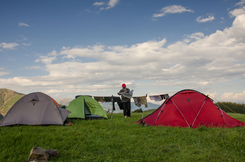Drying muddy clothes at the camp site