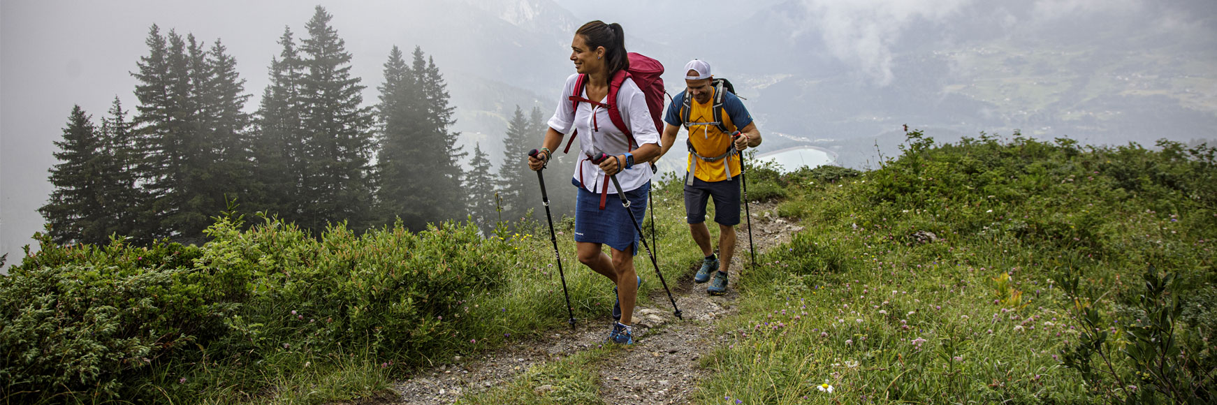 couple hiking walking pol